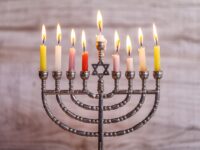 Menorah with lit candles for the Jewish holiday Hanukkah