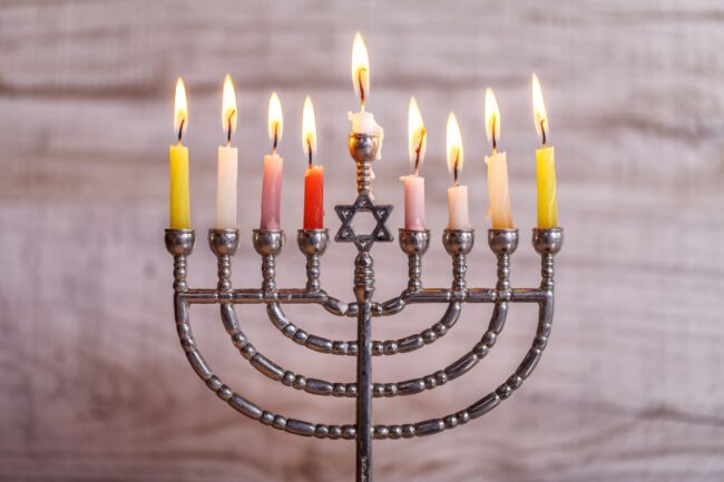 Menorah with lit candles for the Jewish holiday Hanukkah